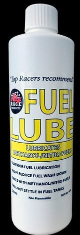 A bottle of ALKY Fuel Lube with yellow label, primarily white text, indicating it is a methanol/nitro fuel intake lubricant.
